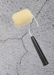 paint roller and a wall crack